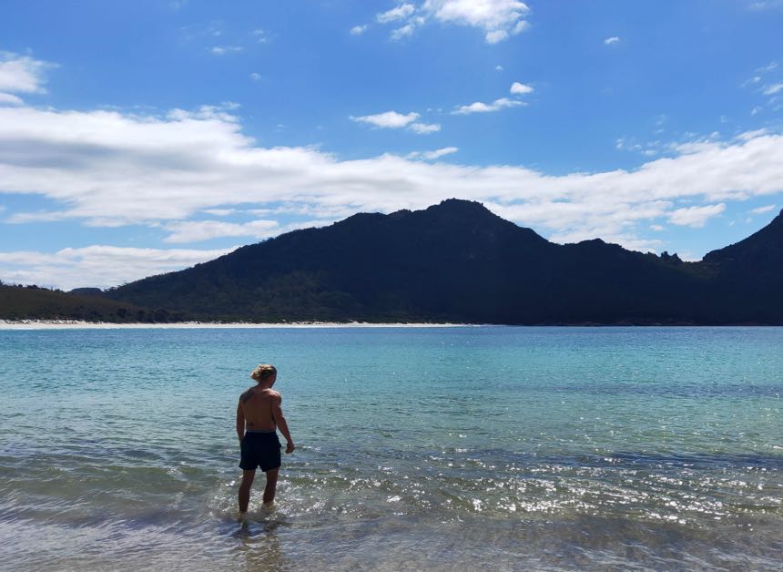 Eddie braves the cool waters of Wine Glass Bay after a day hiking the Freycinet Peninsula Circuit