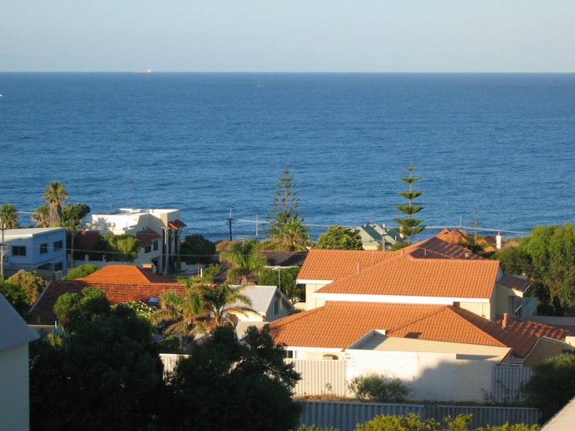 A view of the ocean and a beach side suburb