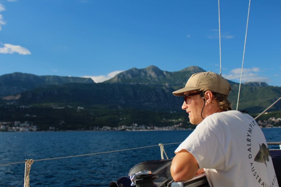 man sailing into the Bay of Kotor in Montenegro