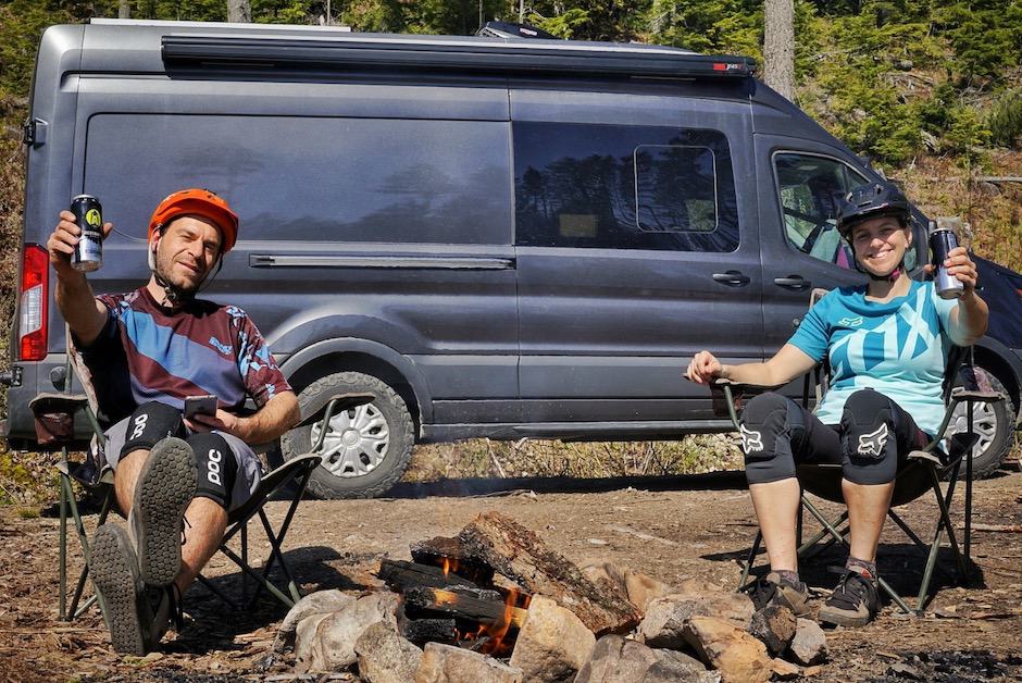 The creators of one of the best van life blogs 2021 Far Out Ride enjoying a beer in front of their van build