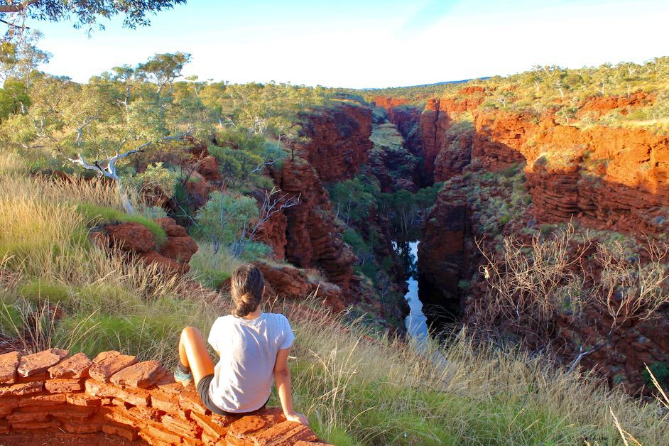 A woman looking at a view of the Karijini Gorges
