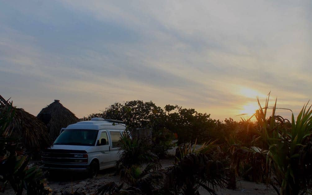 Campsite in El Cuyo, Yucatan Peninsula, Mexico. Is it safe to drive through Mexico at night? No, we think it is best to be parked enjoying a cold beer as the sun sets! 