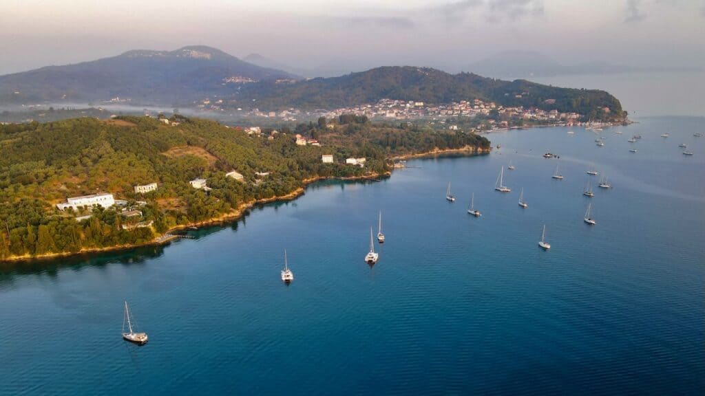 The Cost of Sailing in Greece: A Complete Cruising Budget Breakdown 8 boats anchored corfu ionian greece The Cost of Sailing in Greece: A Complete Cruising Budget Breakdown