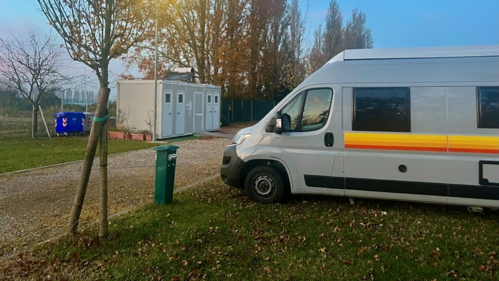 Camper van in Italy parked at an Area di Sosta.
