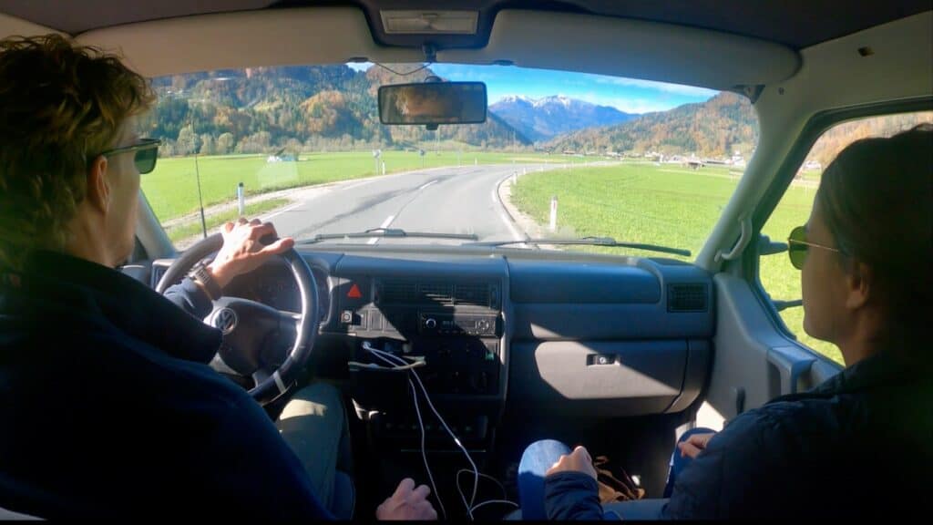 View from the inside of a campervan to mountains